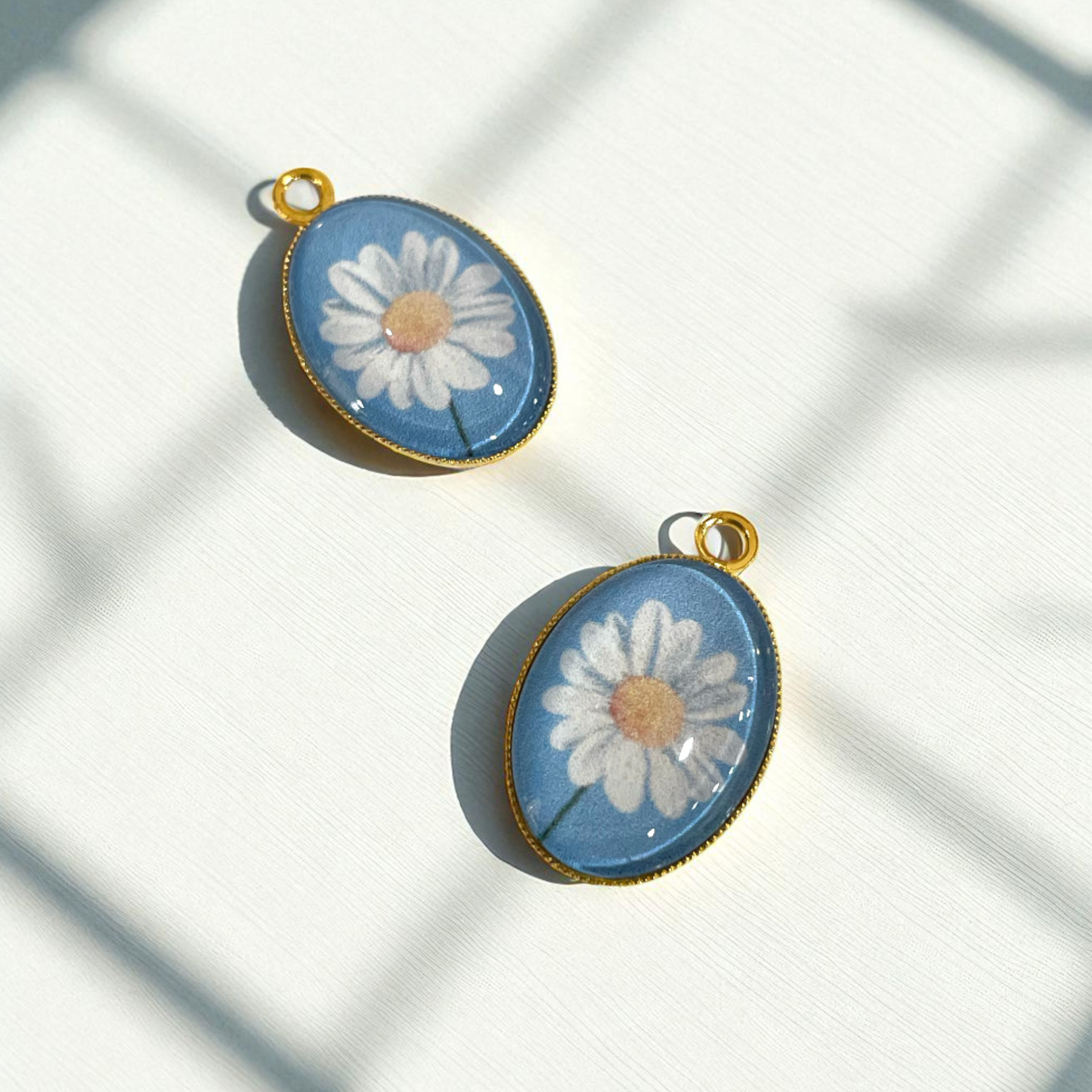 GN02 - Pack of 2pcs - Daisy With Blue Background - Glass Pendants with Metal Base - ClartStudios - Polymer clay Jewellery