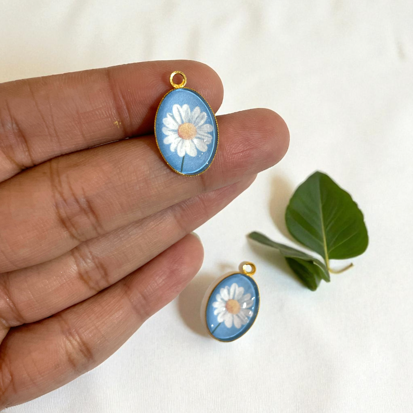 GN02 - Pack of 2pcs - Daisy With Blue Background - Glass Pendants with Metal Base - ClartStudios - Polymer clay Jewellery
