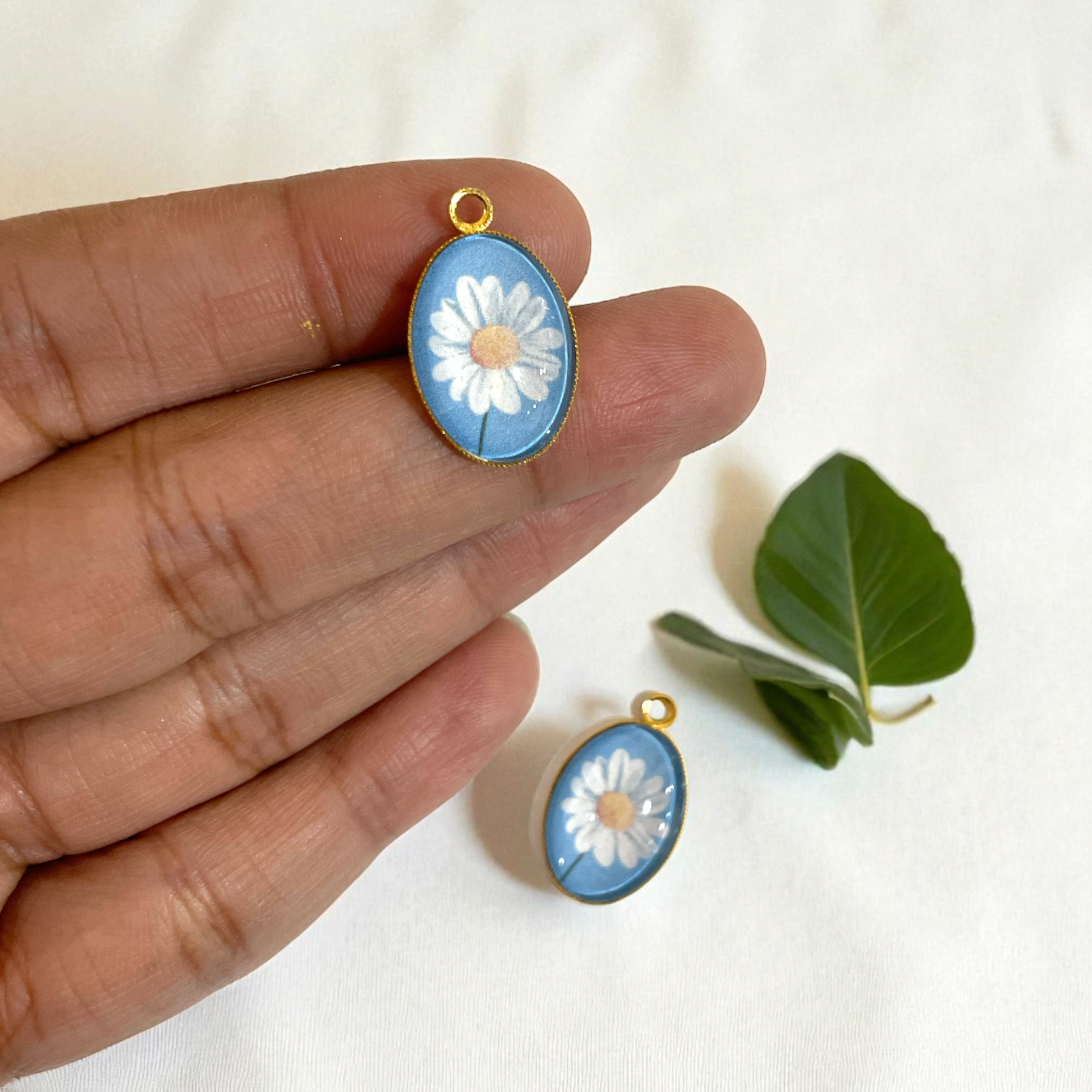 GN02 - Pack of 2pcs - Daisy With Blue Background - Glass Pendants with Metal Base - ClartStudios - Polymer clay Jewellery